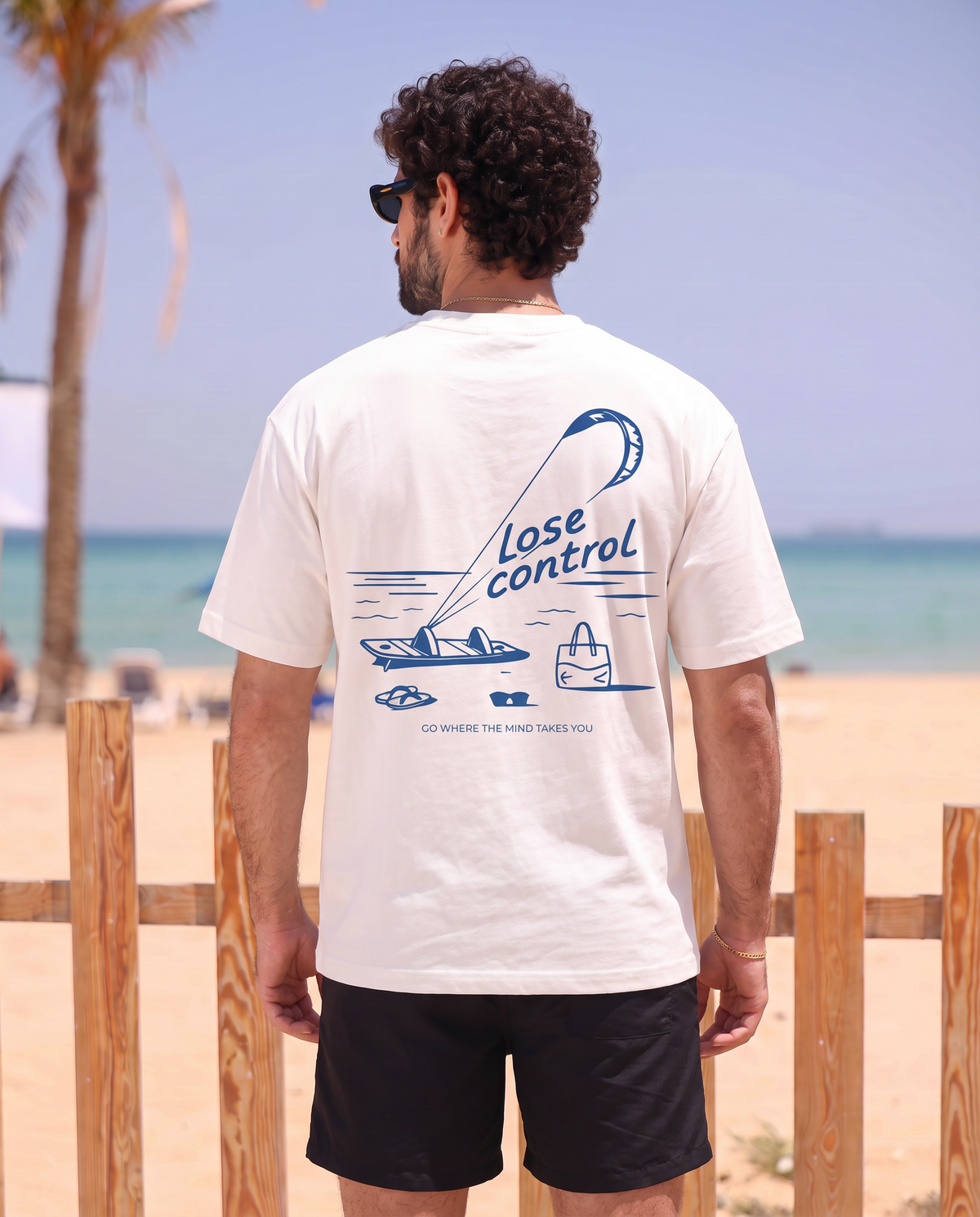 Lose Control T-shirt — back view at beach
