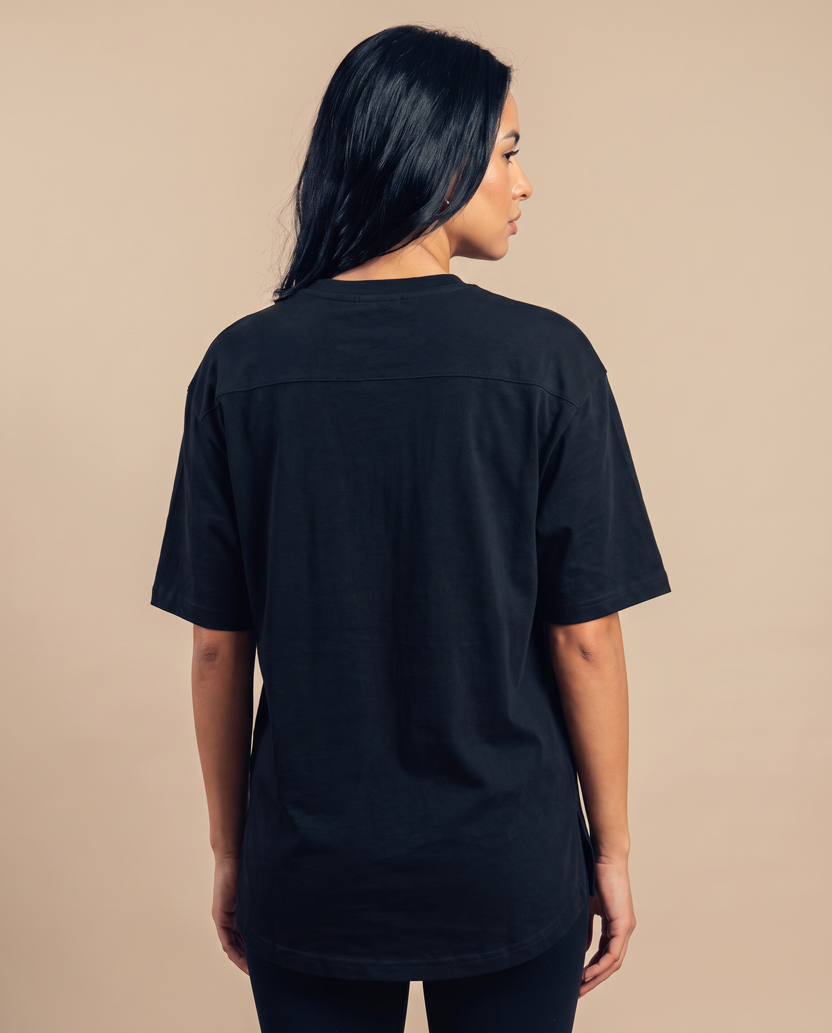 Coreline Black — magnific__back-view-with-subtle-overshoulder-glance-of-femal__67445